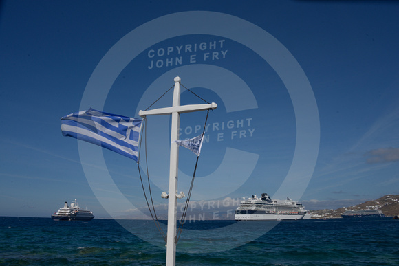 View of the Celebrity Constellation cruise ship from Mykonos harbour, with Greek flag flying